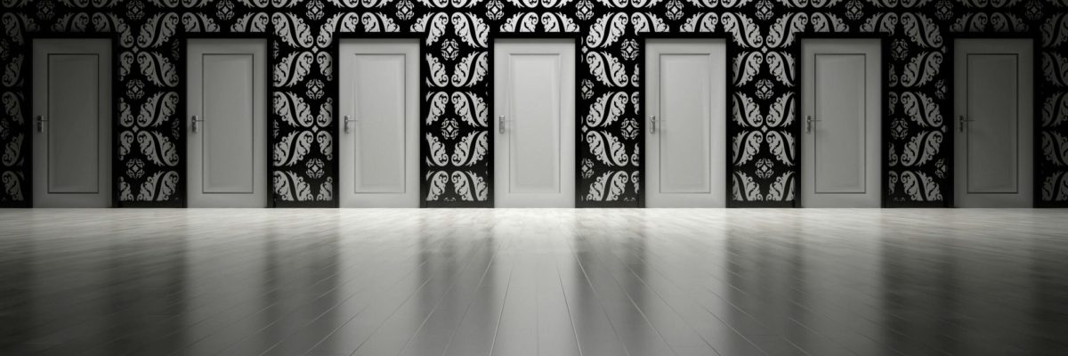 7 white doors in a black pattern wall